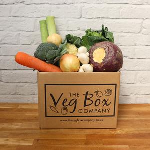 Essentials Veg Box with potatoes, carrots, onions, swede, cauliflower, and more, perfect for casseroles and hearty meals for 2-4 people.